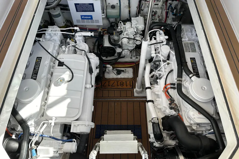 Slide: The Image of Engine room of a 2004 Predator 35 boat, featuring dual Caterpillar engines. - 36
