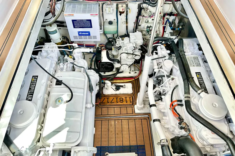 Slide: The Image of Engine room of a 2004 Predator 35 boat with Caterpillar engines and electrical components. - 37