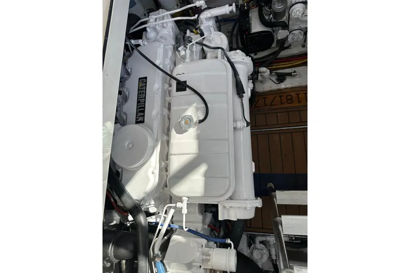 Slide: The Image of Engine compartment of a 2004 Predator 35 boat featuring a Caterpillar engine. - 38