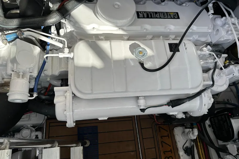 Slide: The Image of Engine compartment of a 2004 Predator 35 boat, featuring a Caterpillar engine. - 39