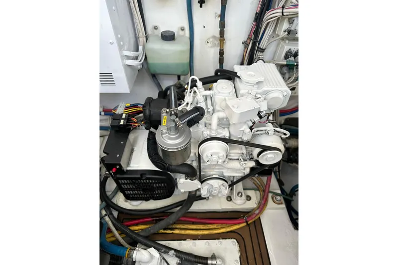 Slide: The Image of Engine compartment of a 2004 Predator 35 boat, showcasing detailed mechanical components. - 40