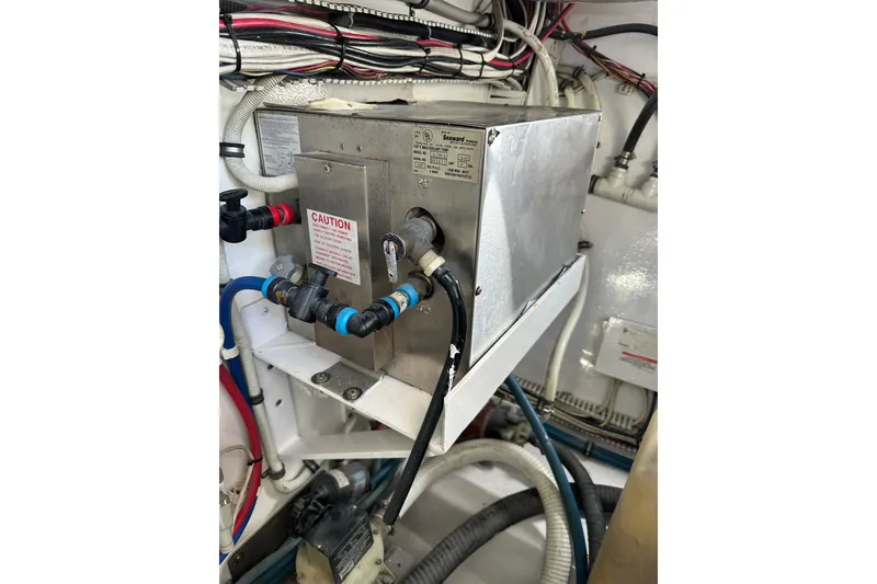 Slide: The Image of Engine room wiring and equipment in a 2004 Predator 35 boat. - 41