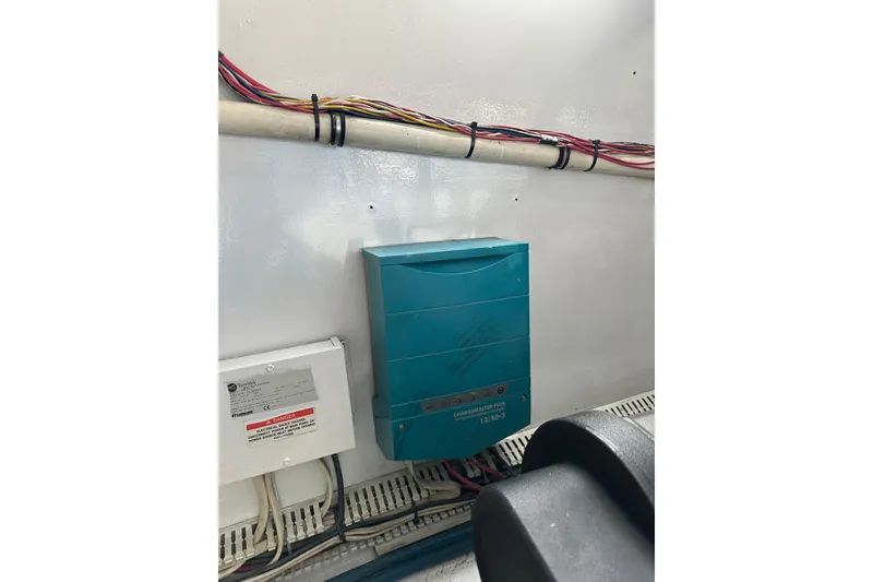 Slide: The Image of Electrical panel and wiring inside a 2004 Predator 35 boat. - 42