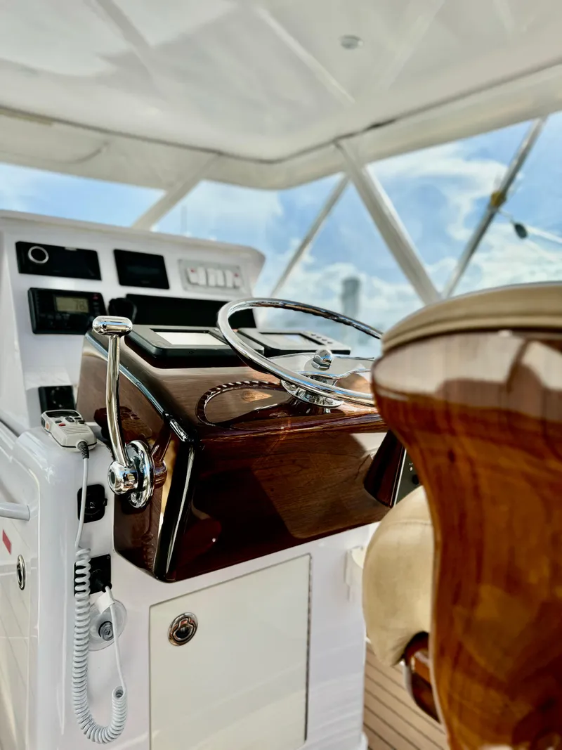 Slide: The Image of Luxury yacht helm with polished wood finish, Predator 35 model, 2004. - 6