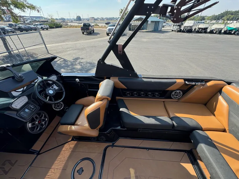 Slide: The Image of Interior of a 2021 Axis A22 boat with tan and black seating. - 19