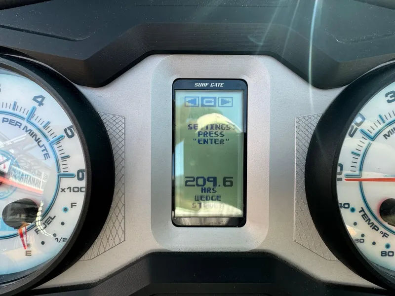 Slide: The Image of Dashboard of a 2021 Axis A22 boat showing 209.6 hours on display. - 21