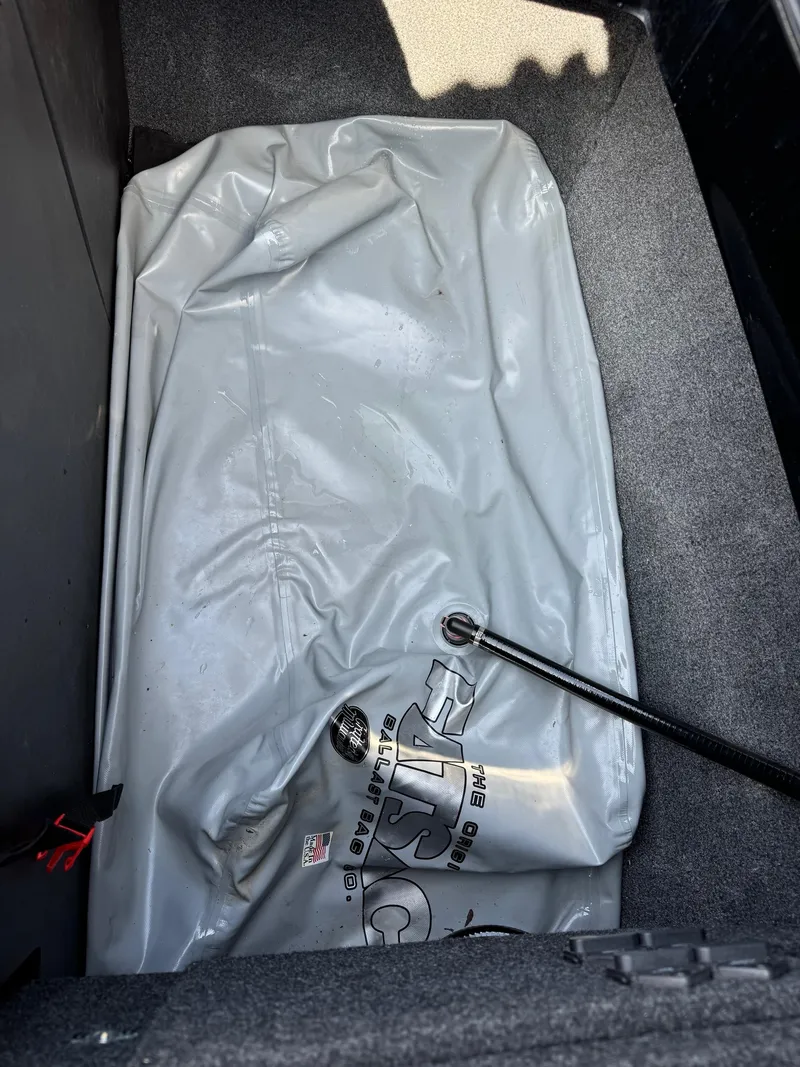 Slide: The Image of 2021 Axis A22 ballast bag in boat storage compartment. - 23