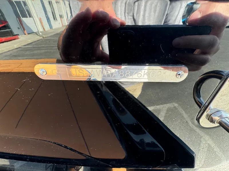 Slide: The Image of Close-up of a 2021 Axis A22 boat's identification plate with reflection. - 25