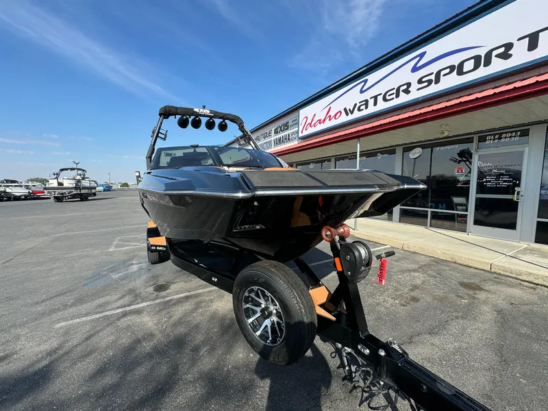 Slide: The Image of 2021 Axis A22 boat on trailer at Idaho Water Sports dealership. - 4