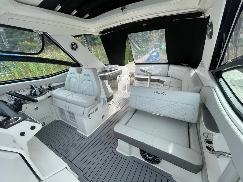 Slide: The Image of 2020 Sea Ray Sundancer 320 interior with modern seating and sleek design. - 13