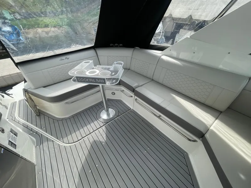 Slide: The Image of 2020 Sea Ray Sundancer 320 interior with seating and cocktail bar. - 14