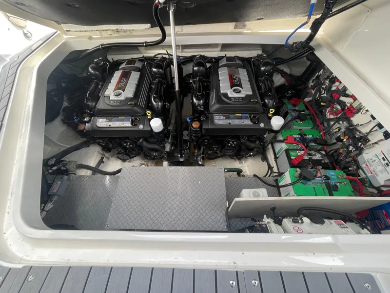 Slide: The Image of Engine compartment of 2020 Sea Ray Sundancer 320 with dual engines and batteries. - 34