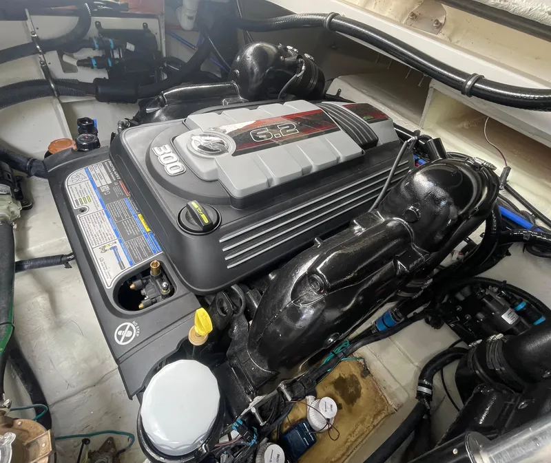 Slide: The Image of 2020 Sea Ray Sundancer 320 engine compartment with powerful 300 HP engine. - 36