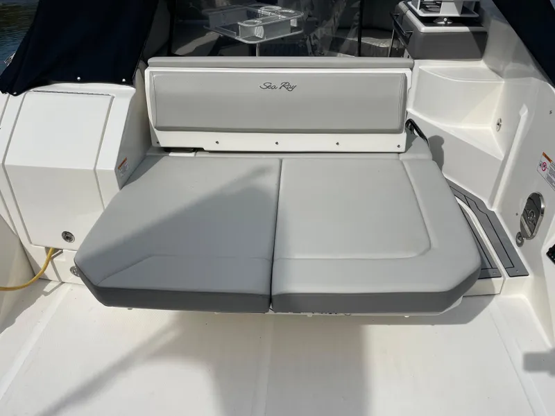 Slide: The Image of 2020 Sea Ray Sundancer 320 boat seating area with gray cushions. - 7