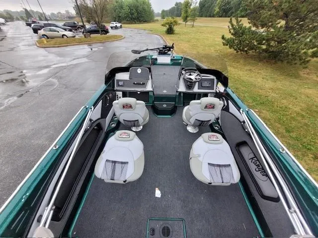 Slide: The Image of 2024 Ranger 2080MS boat interior with dual seats and steering console. - 4