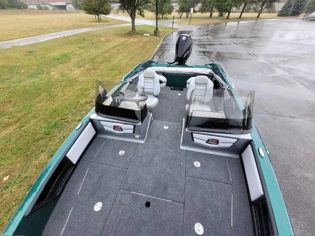 Slide: The Image of 2024 Ranger 2080MS boat with spacious deck and seating on a rainy day. - 5