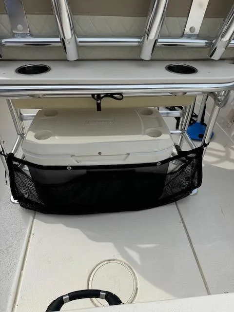 Slide: The Image of 2022 Sea Chaser 22 HFC boat deck with cooler and storage rack. - 10