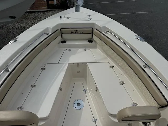 Slide: The Image of 2022 Sea Chaser 22 HFC boat interior with seating and storage compartments. - 12