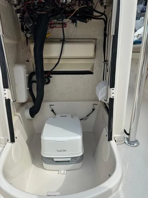 Slide: The Image of 2022 Sea Chaser 22 HFC boat interior with portable toilet and wiring. - 18