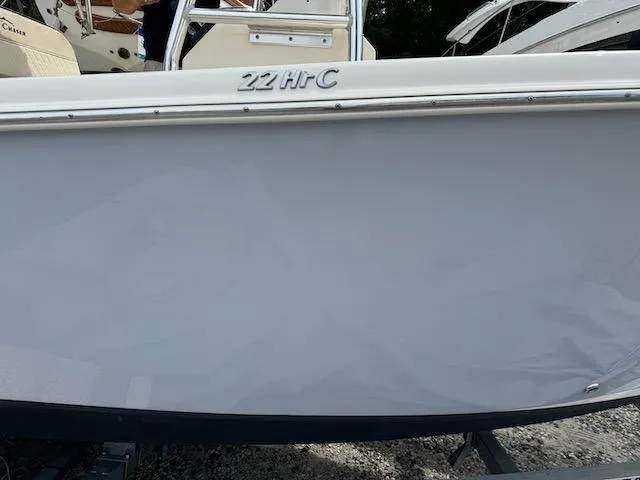 Slide: The Image of 2022 Sea Chaser 22 HFC boat side view, showcasing model name and sleek design. - 21