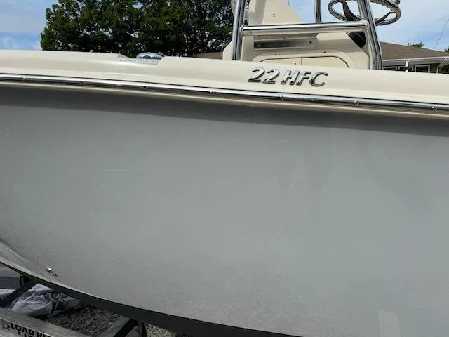 Slide: The Image of 2022 Sea Chaser 22 HFC boat side view with visible model name. - 22