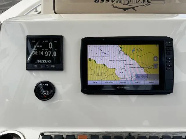 Slide: The Image of Dashboard of 2022 Sea Chaser 22 HFC with Garmin navigation and Suzuki display. - 3