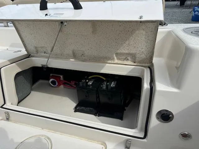 Slide: The Image of Open battery compartment of 2022 Sea Chaser 22 HFC boat, showing dual batteries. - 5