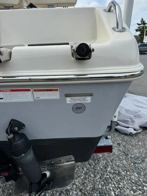 Slide: The Image of 2022 Sea Chaser 22 HFC boat stern with motor and safety labels. - 7