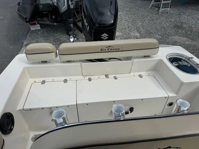 Slide: The Image of 2022 Sea Chaser 22 HFC boat interior with seating and storage compartments. - 9