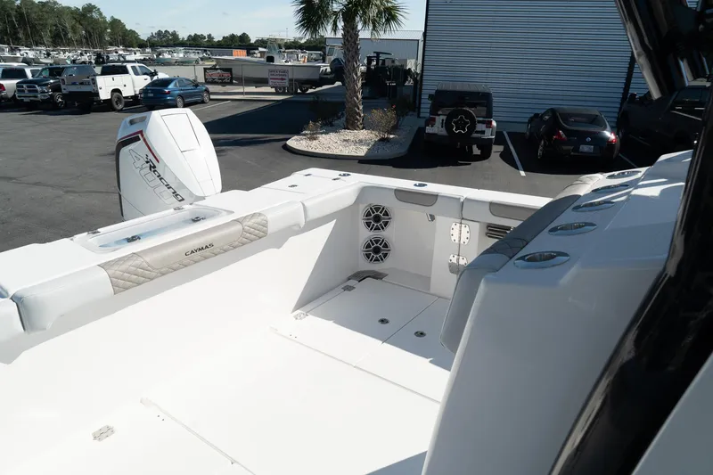 Slide: The Image of 2025 Caymas 34 CT boat interior with modern design and powerful outboard motor. - 13