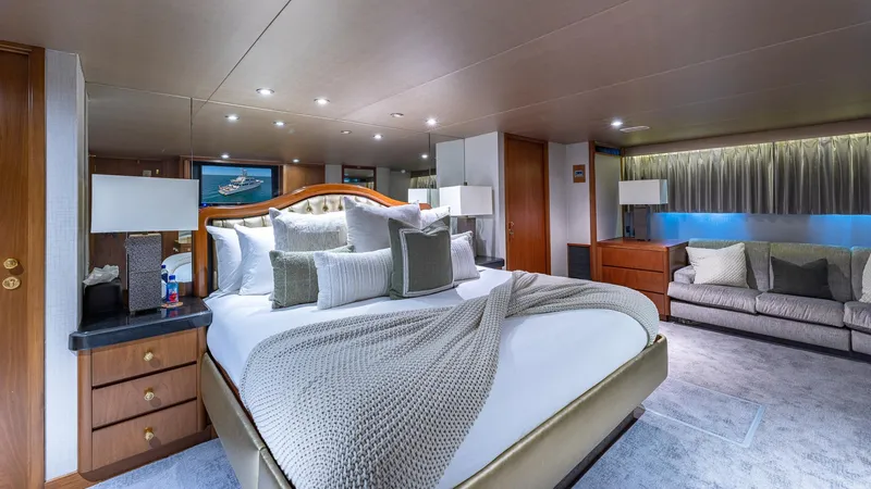 Slide: The Image of Luxurious bedroom interior on 1985 Feadship Custom yacht, featuring elegant decor and plush bedding. - 10