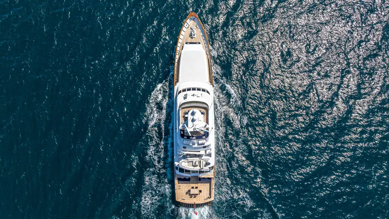 Slide: The Image of Aerial view of 1985 Feadship Custom yacht cruising on open water. - 32