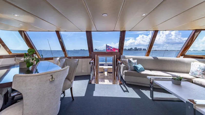 Slide: The Image of Luxurious interior of 1985 Feadship Custom yacht with panoramic ocean views and elegant furnishings. - 5