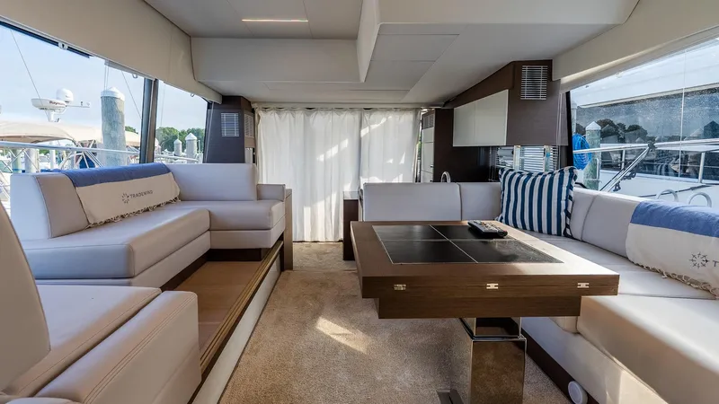 Slide: The Image of Luxurious interior of a 2019 Prestige 520 Flybridge yacht with elegant seating and table. - 10