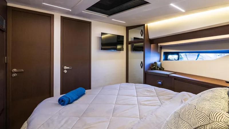 Slide: The Image of Luxurious bedroom interior of 2019 Prestige 520 Flybridge yacht with modern decor. - 18