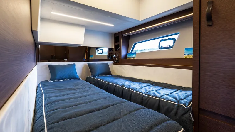 Slide: The Image of Luxurious twin cabin interior of 2019 Prestige 520 Flybridge yacht. - 19