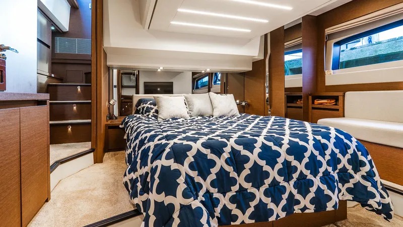 Slide: The Image of Luxurious bedroom interior of 2019 Prestige 520 Flybridge yacht with modern design and cozy bedding. - 20