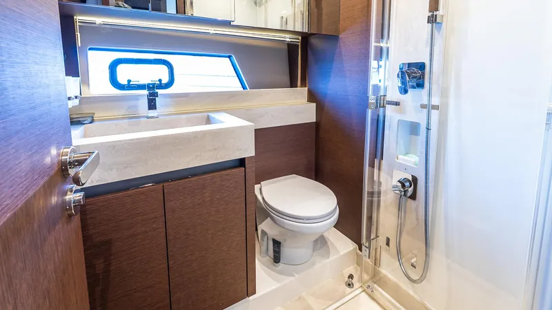 Slide: The Image of Luxurious bathroom on 2019 Prestige 520 Flybridge yacht with modern fixtures and elegant design. - 23