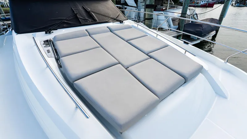 Slide: The Image of 2019 Prestige 520 Flybridge yacht with spacious sunbathing area and sleek design. - 28