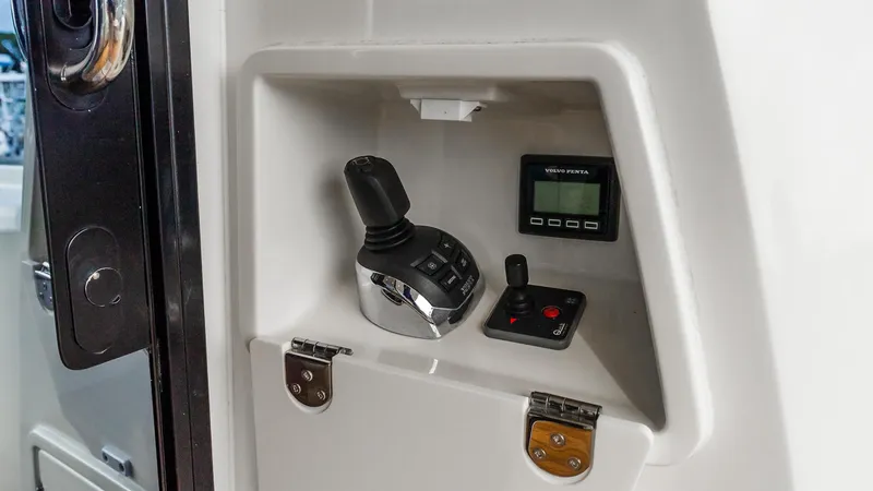 Slide: The Image of Control panel of 2019 Prestige 520 Flybridge with joystick and Volvo Penta display. - 3
