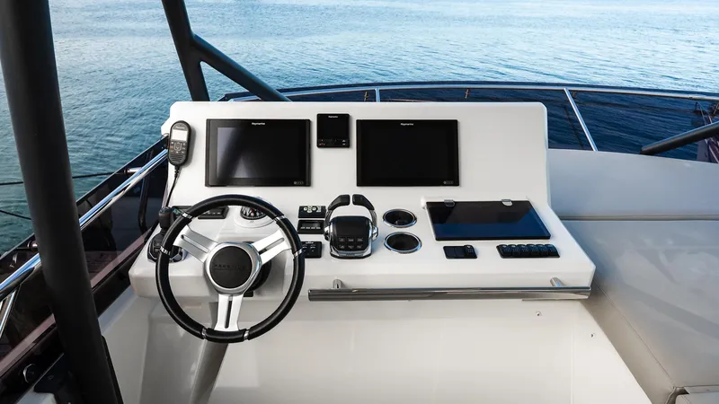 Slide: The Image of Flybridge helm of 2019 Prestige 520 yacht with modern navigation controls. - 34