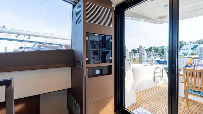 Slide: The Image of Interior view of 2019 Prestige 520 Flybridge yacht with outdoor deck and seating area. - 4