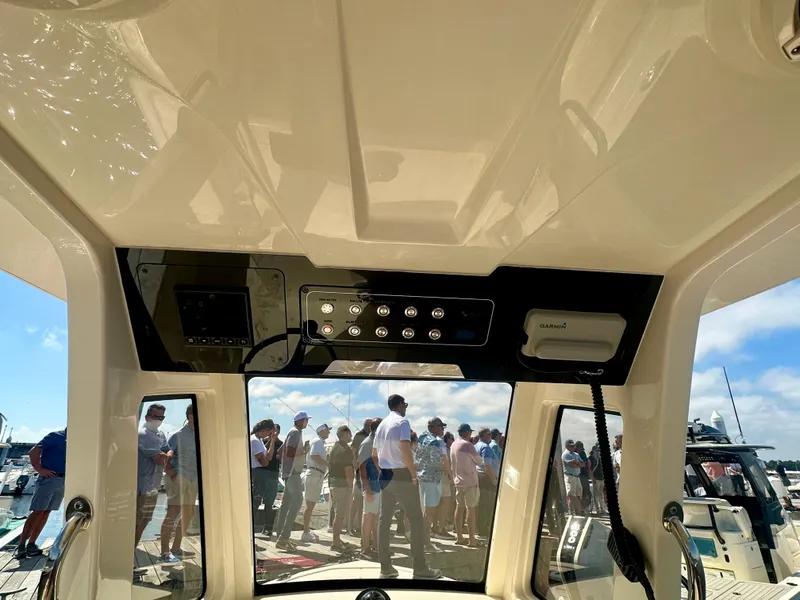 Slide: The Image of 2026 Scout 261 XSS boat interior with control panel, viewed from inside. - 3