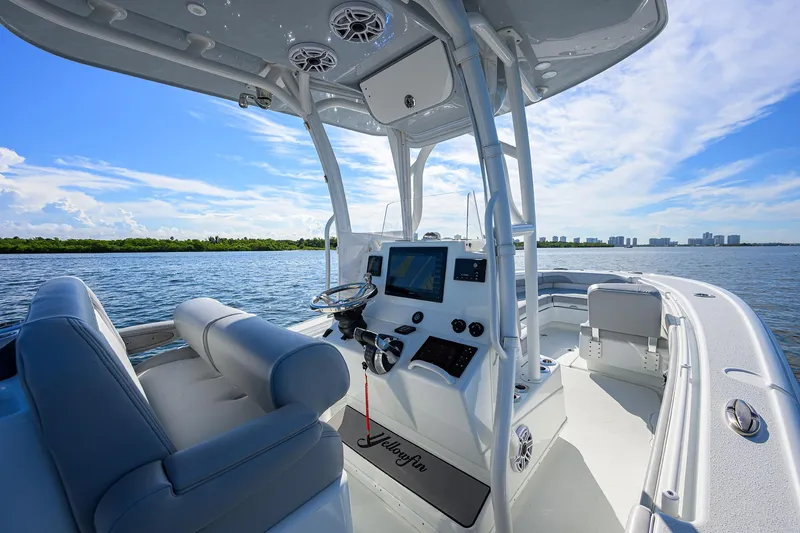Slide: The Image of 2021 Yellowfin 26 Hybrid boat interior with modern console on a sunny day. - 15