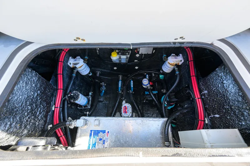 Slide: The Image of Engine compartment of 2021 Yellowfin 26 Hybrid boat, showcasing internal components and wiring. - 19