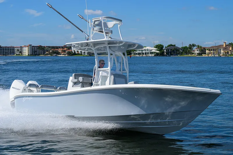 Slide: The Image of 2021 Yellowfin 26 Hybrid boat cruising on a sunny day. - 5