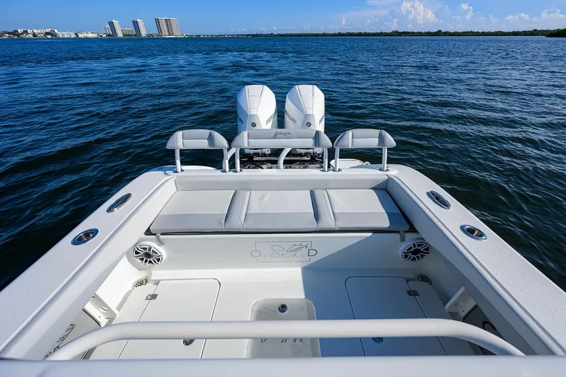 Slide: The Image of 2021 Yellowfin 26 Hybrid boat on open water with twin engines. - 9
