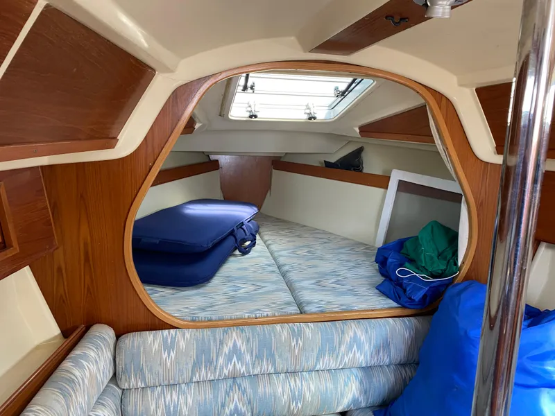 Slide: The Image of Interior of 1988 Pearson 28 sailboat with cozy cabin and storage space. - 13