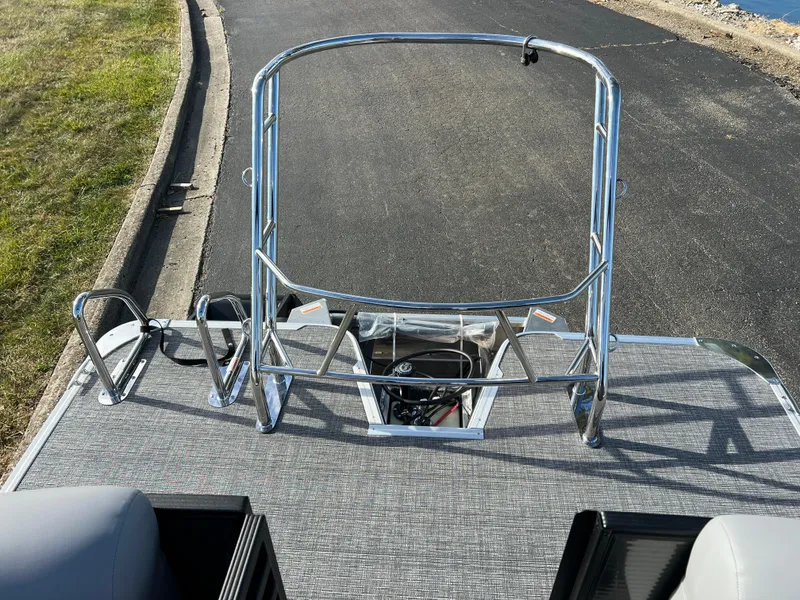 Slide: The Image of 2025 Crest CLASSIC 220 SLC boat with sleek metal railing and textured deck. - 20