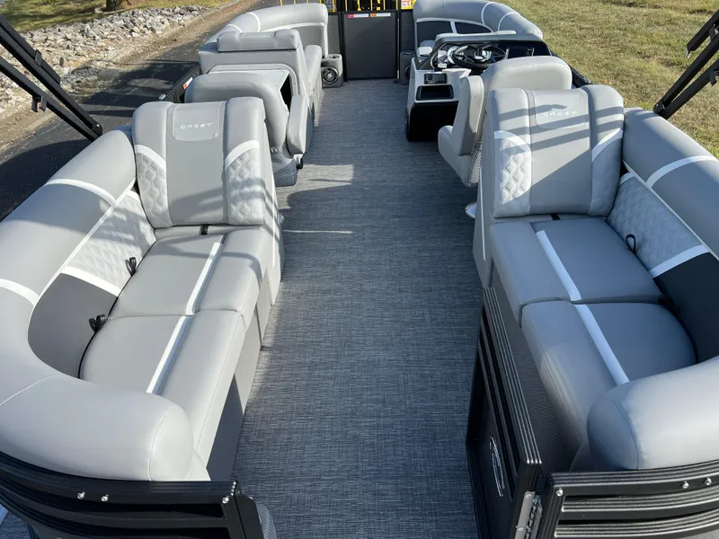 Slide: The Image of 2025 Crest CLASSIC 220 SLC pontoon boat interior with gray seating and modern design. - 21